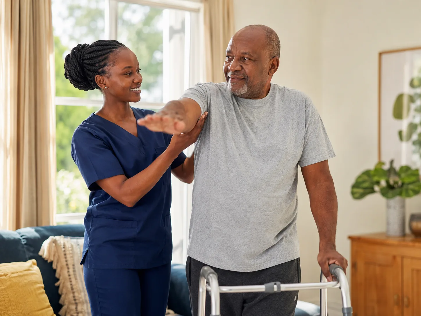Physiotherapist providing rehabilitative care at home